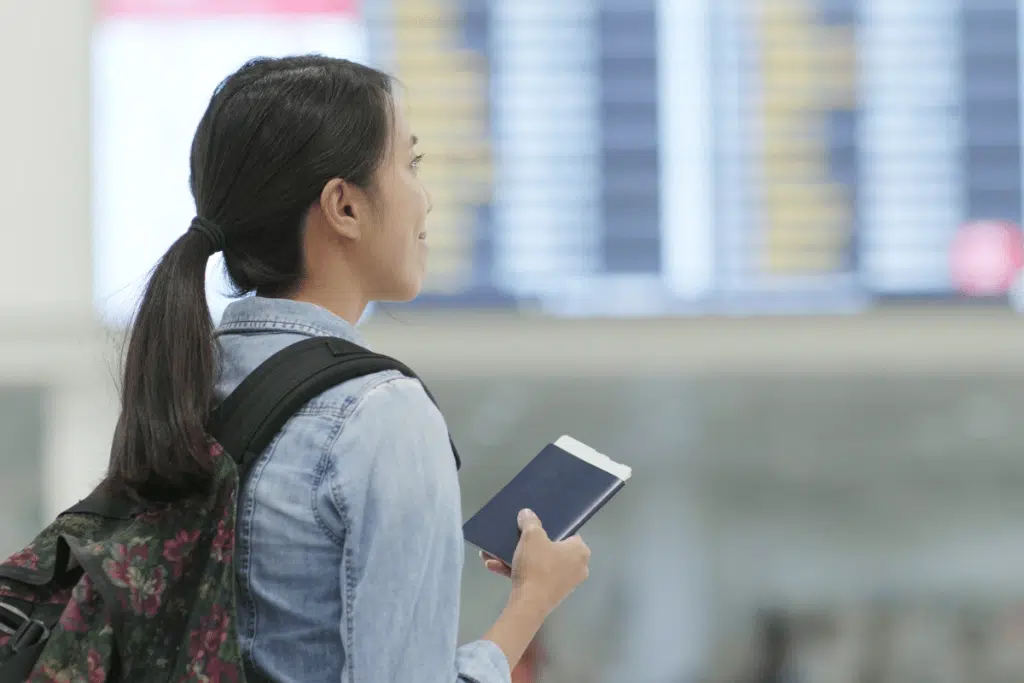 passport update, woman looking at travel documents